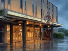 Hastings Casino entrance canopy on a rainy evening